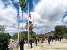 Members of Soboba Fire Dpt raise flag at ceremony