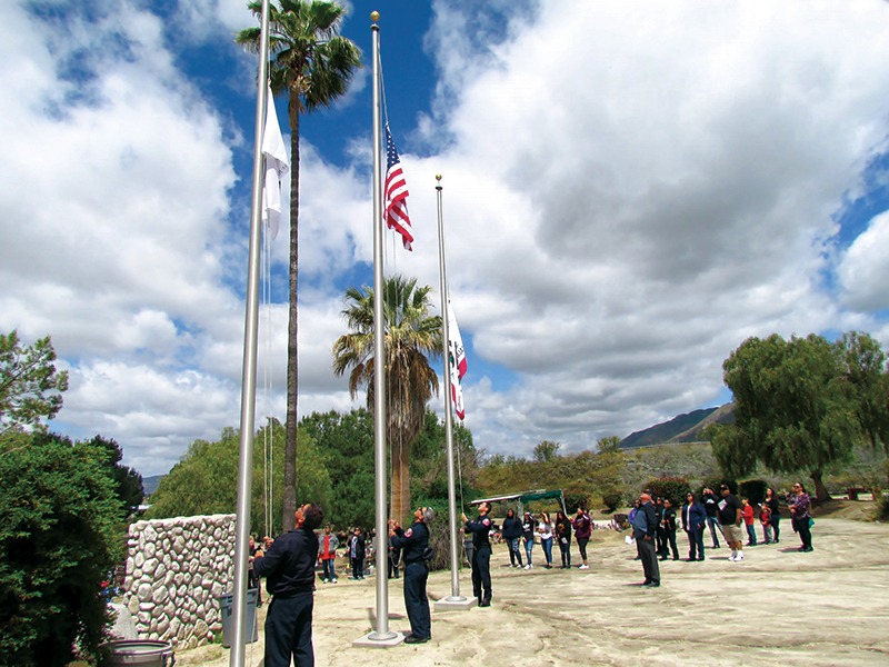 Members of Soboba Fire Dpt raise flag at ceremony