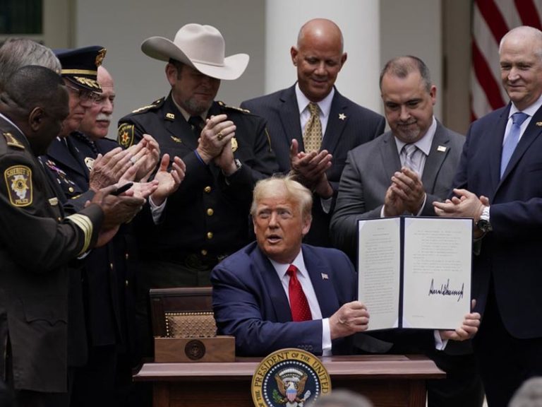 Trump signs order on police reform, doesn’t mention racism