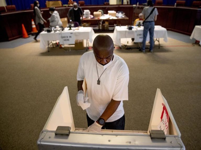 Curfews, pandemic test voters in primaries held amid unrest
