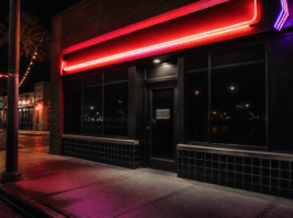 Illustration of a closed bar storefront at night with a CLOSED sign, no people