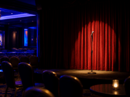 Illustration of an empty comedy stage with a microphone under a spotlight, no people